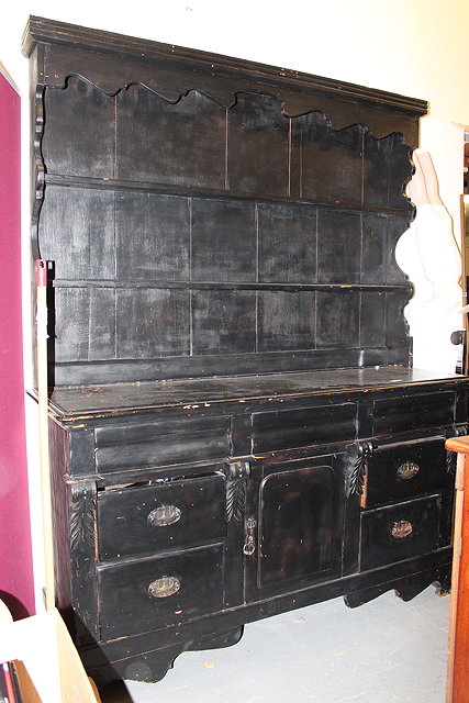 Appraisal: A BLACK PAINTED PINE DRESSER with plate rack back cm