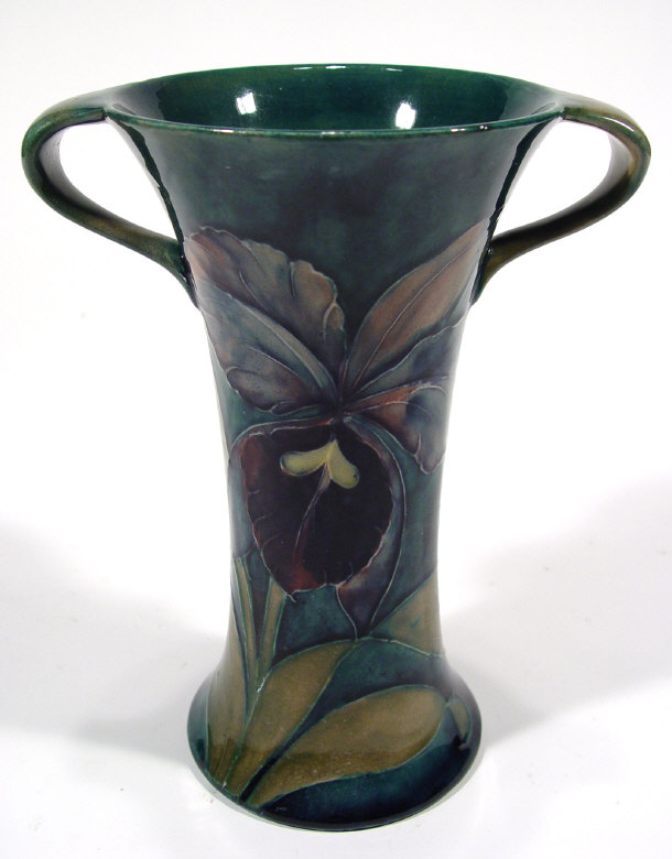 Appraisal: Early Moorcroft two handled pottery vase hand painted and tubelined