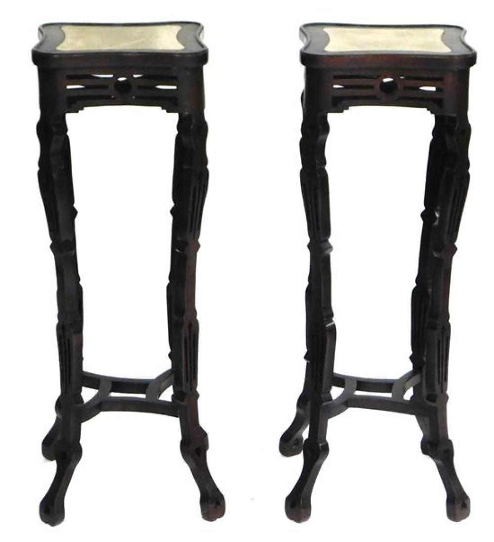 Appraisal: ASIAN Pair of Chinese style tall stands inset with shaped