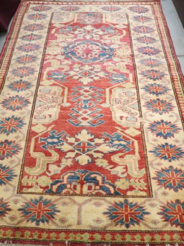 Appraisal: Kazak Persian Handmade Rug interesting geometrics salmon ivory vlues '