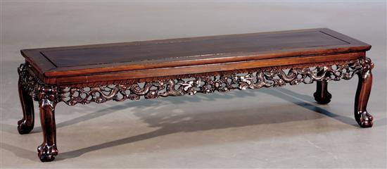 Appraisal: Chinese carved mahogany coffeetable rectangular frame-and-panel top on pierced base