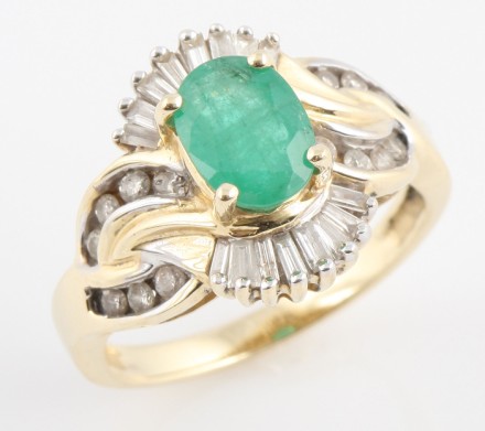 Appraisal: K one mm x mm oval emerald baguette diamonds ct