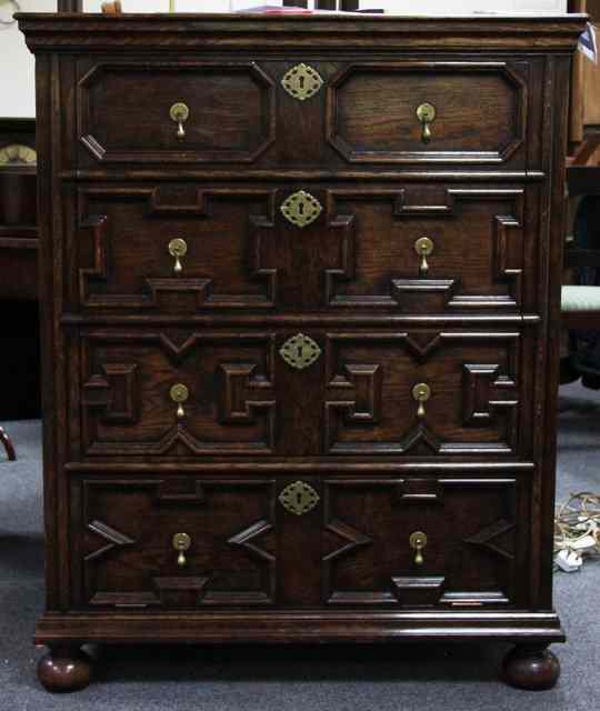 Appraisal: An oak moulded front cabinet th century style for television