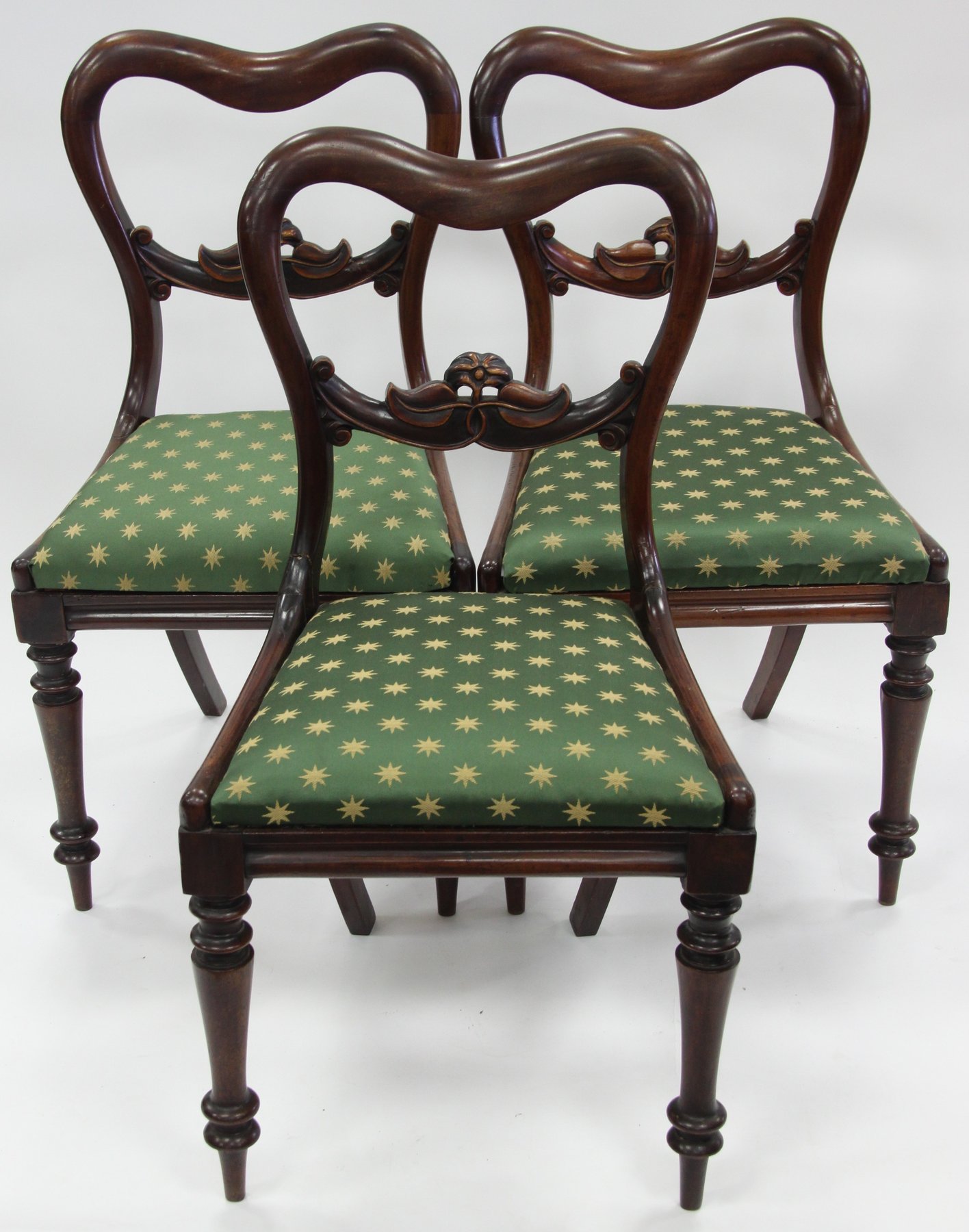 Appraisal: Three Victorian mahogany dining chairs with carved horizontal splats on