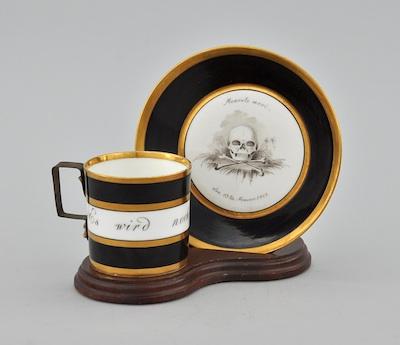 Appraisal: A Porcelain Memento Mori Cup and Saucer Inscribed with the