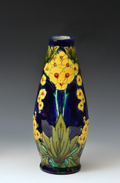 Appraisal: Minton Secessionist vasecirca decorated with yellow primula flowers in blue