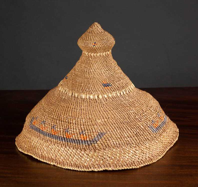 Appraisal: NOOTKA WOVEN BASKETRY HAT with figures in canoes motif Dimensions