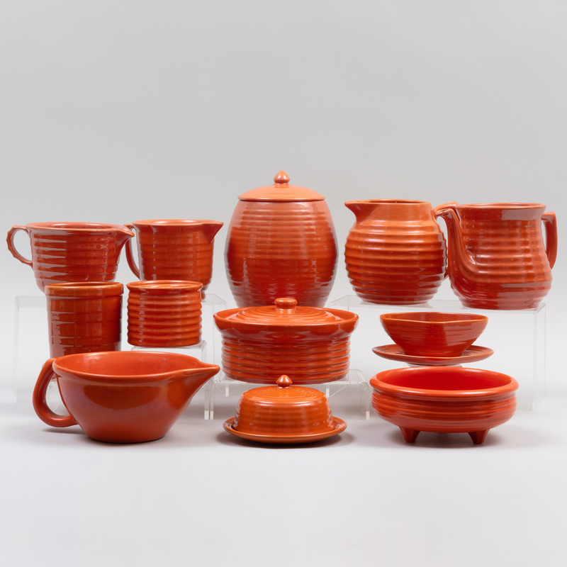 Appraisal: Group of Orange Glazed Table Wares Unmarked Comprising A canister