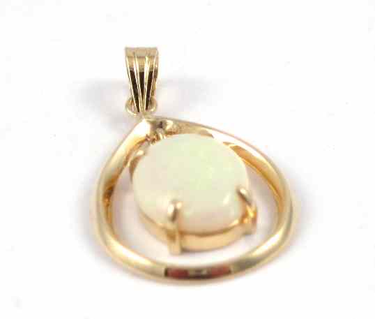 Appraisal: OPAL AND FOURTEEN KARAT GOLD PENDANT set with an oval