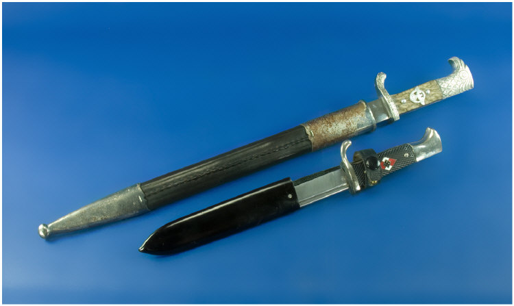 Appraisal: German Daggers both in sheaths and inches in length