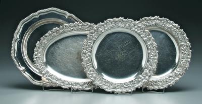 Appraisal: Four Tiffany silver plated trays pair round with floral border