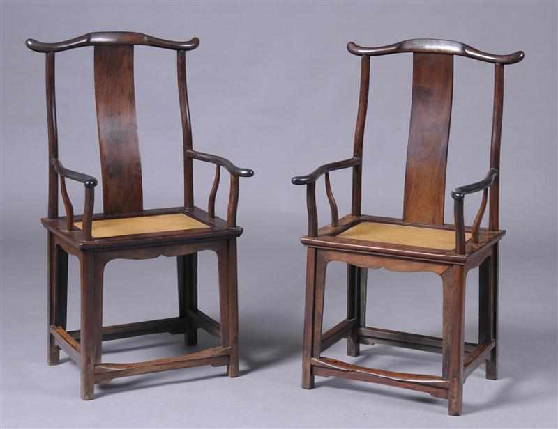 Appraisal: PAIR OF MING STYLE CARVED HARDWOOD ARMCHAIRS Each yoked crest