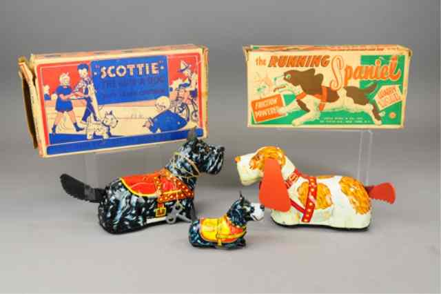 Appraisal: MARX TIN TOY DOG LOT Lithographed tin includes two Scottie