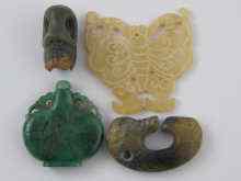 Appraisal: Four Chinese jade or hardstone items being a green snuff