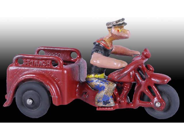 Appraisal: Cast Iron Hubley Popeye Spinach Cycle Toy Description Three-wheel Red