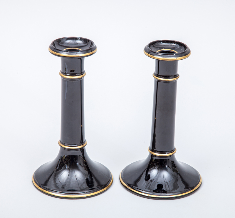 Appraisal: AESTHETIC MOVEMENT PAIR OF CANDLESTICKS Black glazed and gilt terracotta