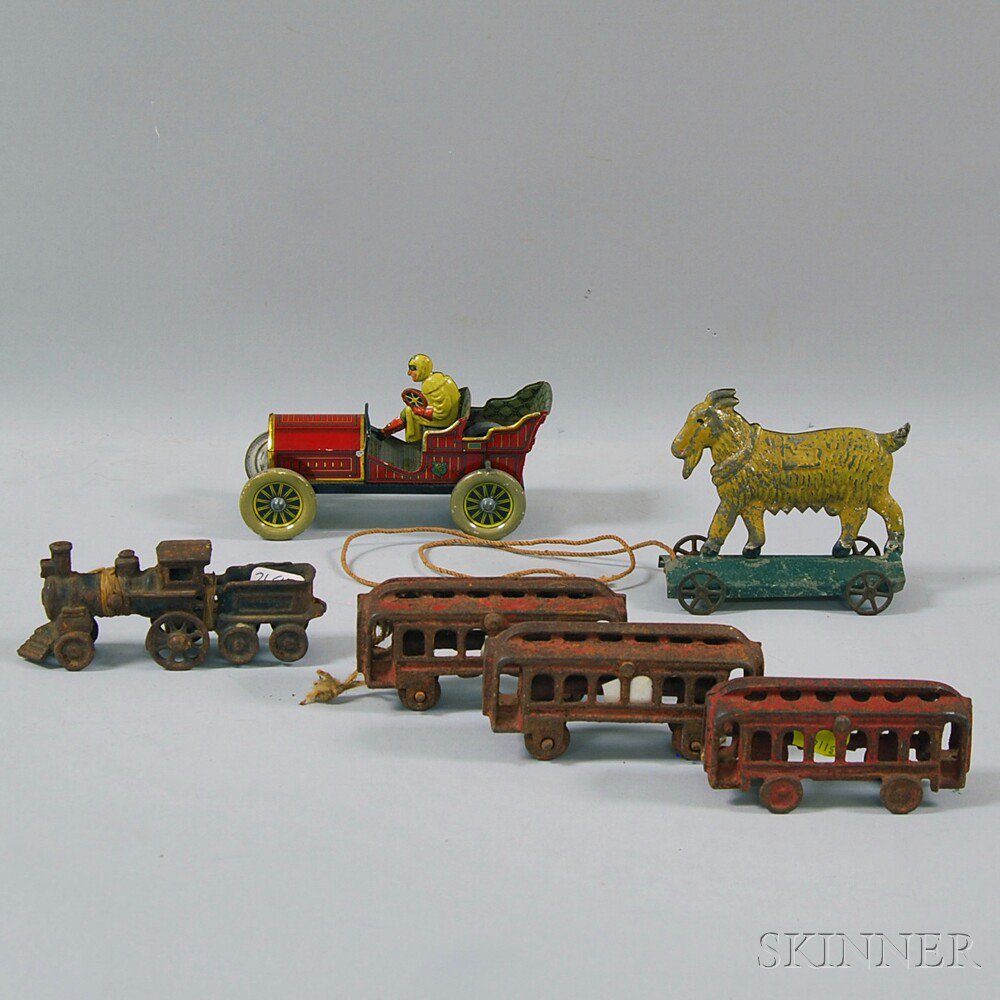 Appraisal: Four-piece Cast Iron Train Tin Friction Roadster and Goat on