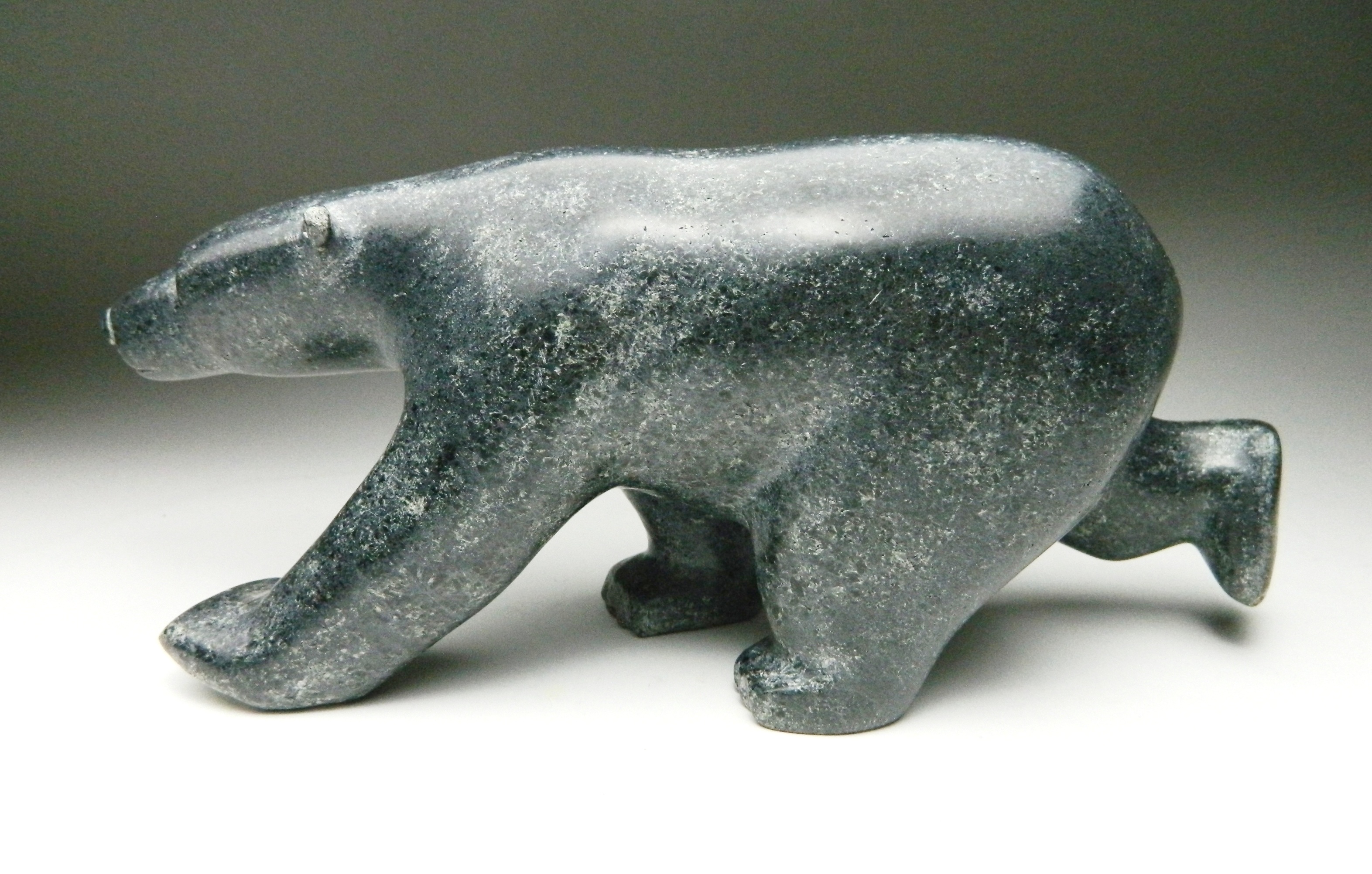 Appraisal: Komartok Curley Cape Dorset Running Polar Bear- stone carving x