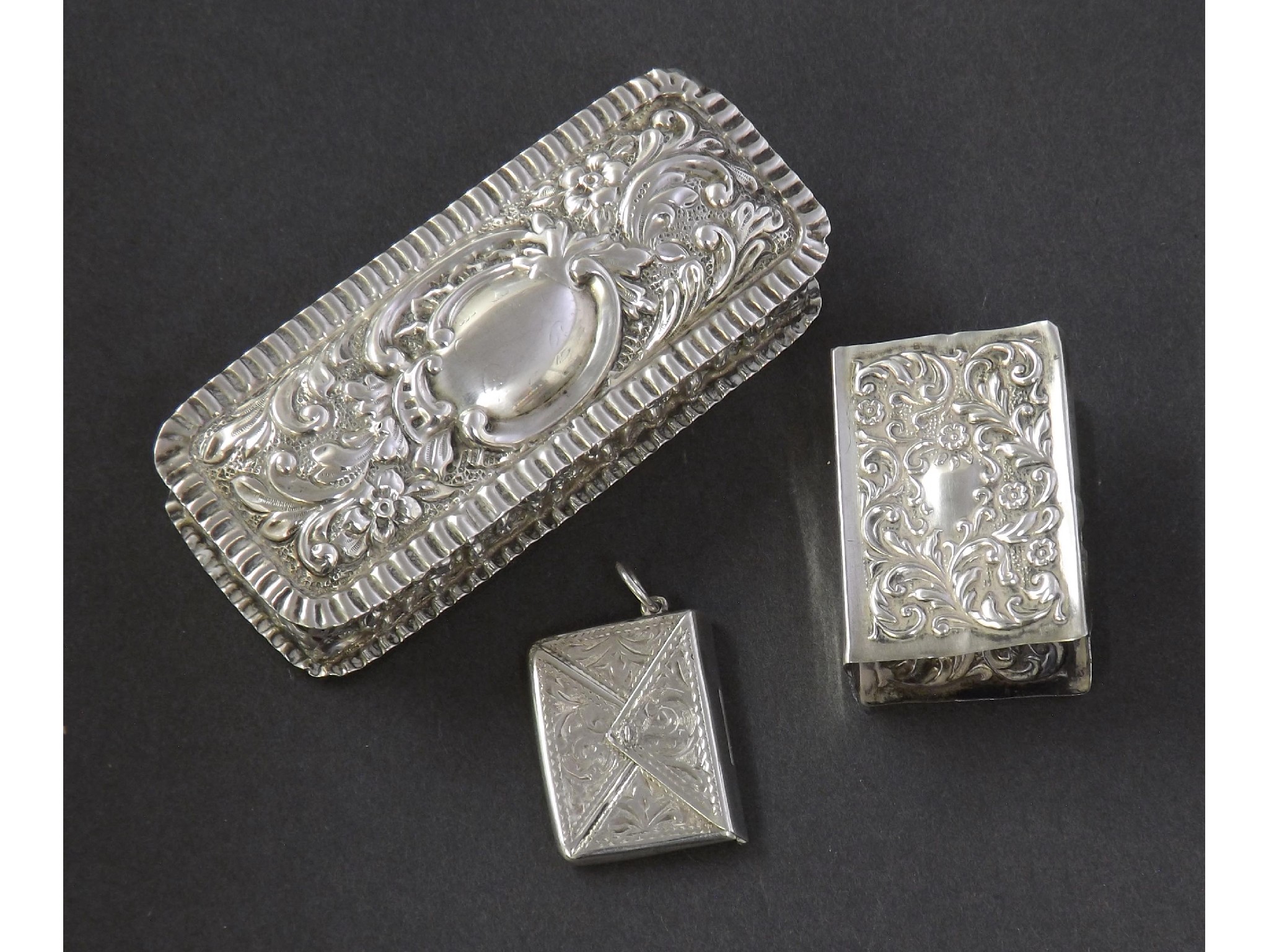 Appraisal: Sterling silver envelope stamp holder Edwardian silver matchbox holder embossed