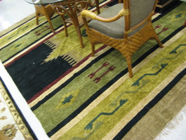 Appraisal: HAND KNOTTED WOOL CARPET American Indian design ' x '