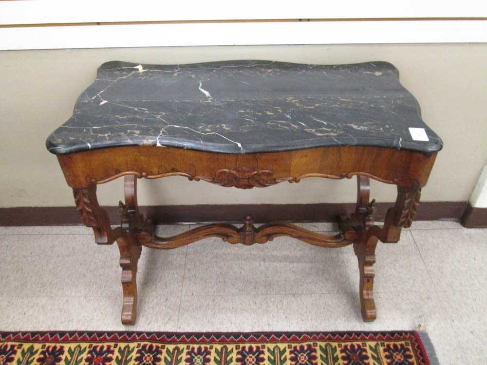 Appraisal: A VICTORIAN MARBLE-TOP CONSOLE TABLE American th century a rectangular