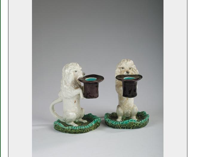 Appraisal: PAIR OF SARREGUEMINES FAIENCE FIGURAL CHAMBERSTICKS CIRCA Each modelled as