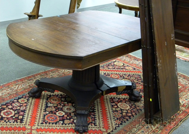 Appraisal: Empire Carved Mahogany and Mahogany Veneer Pedestal-base Dining Table with