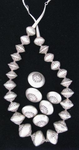 Appraisal: Set of Navajo graduated stamped silver beads with horn clasp