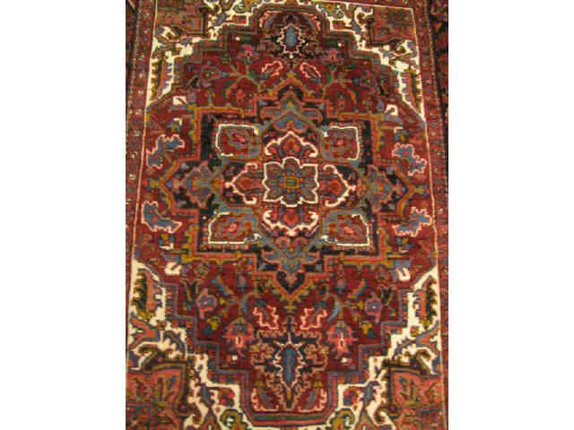 Appraisal: Heriz Persian Handmade Rug overall medallion deep rich earthtones '