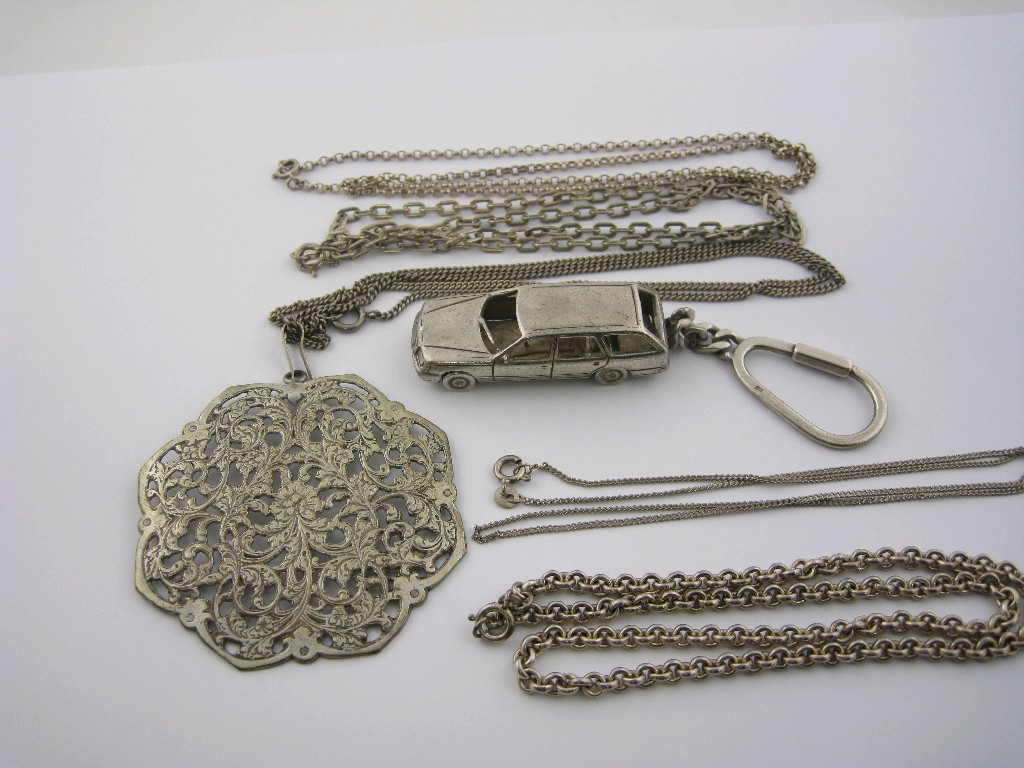 Appraisal: Four various silver Chains a pierced and engraved white metal