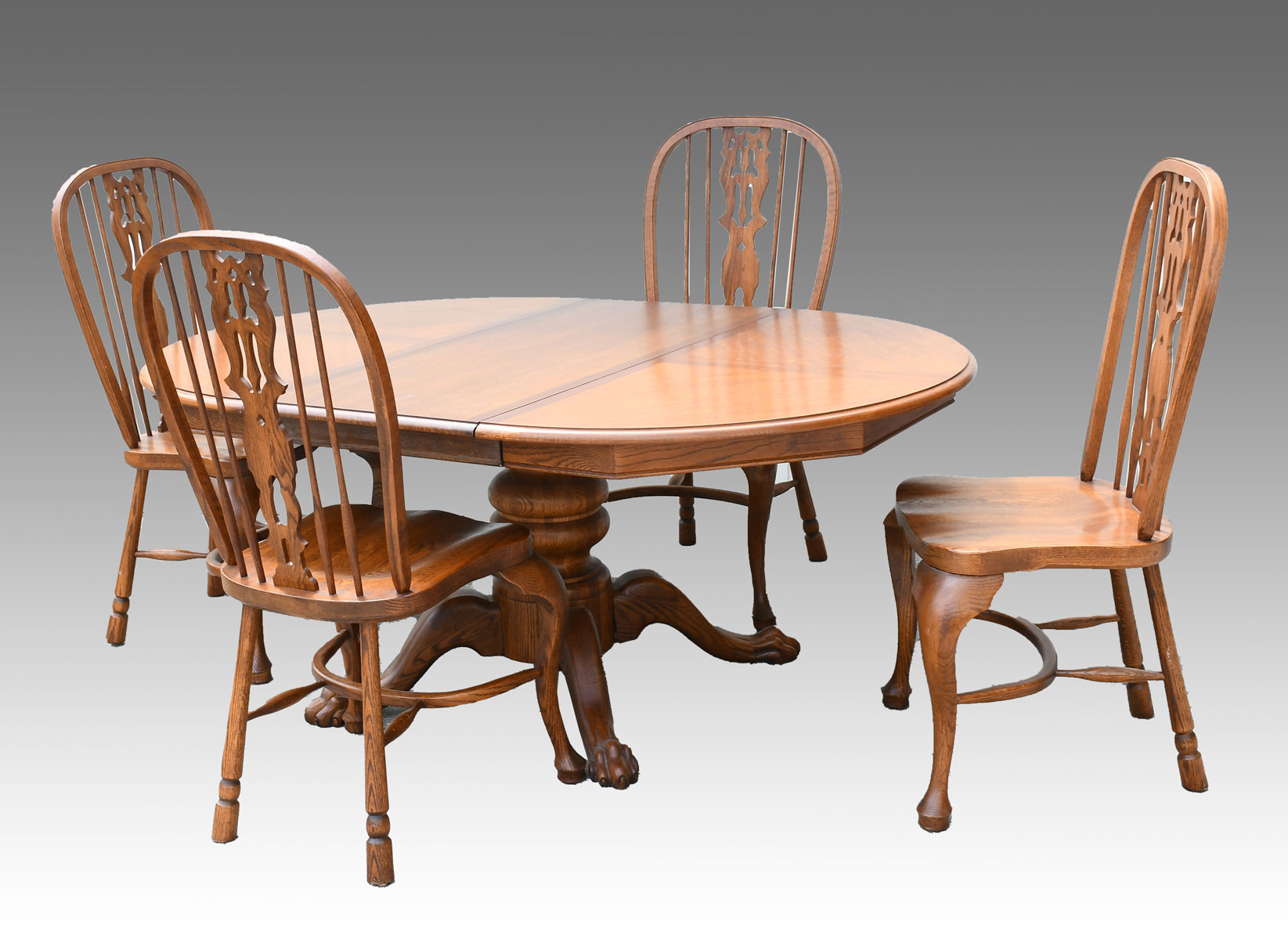 Appraisal: OAK DINING TABLE WITH WINDSOR STYLE CHAIRS Oak dining table