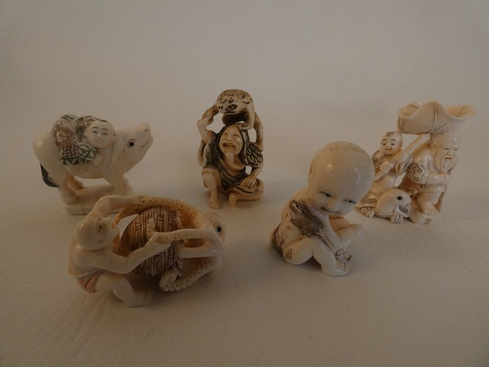 Appraisal: JAPANESE NETSUKES Lot assorted old Japanese carved netsukes baby with