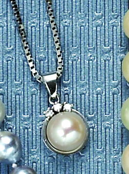 Appraisal: PEARL AND DIAMOND PENDANT k white gold pendant and box