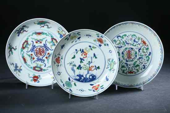 Appraisal: THREE CHINESE DOUCAI PORCELAIN PLATES Yongzheng six character mark Floral