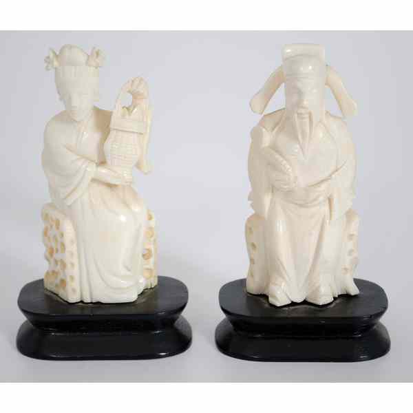 Appraisal: Chinese Ivory Scholar Carvings China A pair of seated figures