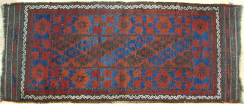 Appraisal: Beluch throw rug ca with red floral decoration on a