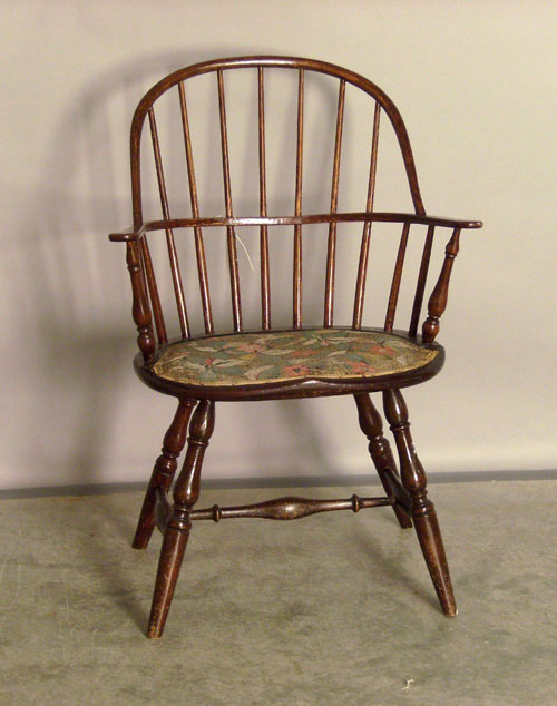 Appraisal: Windsor sack back armchair with padded seat Provenance Collection of