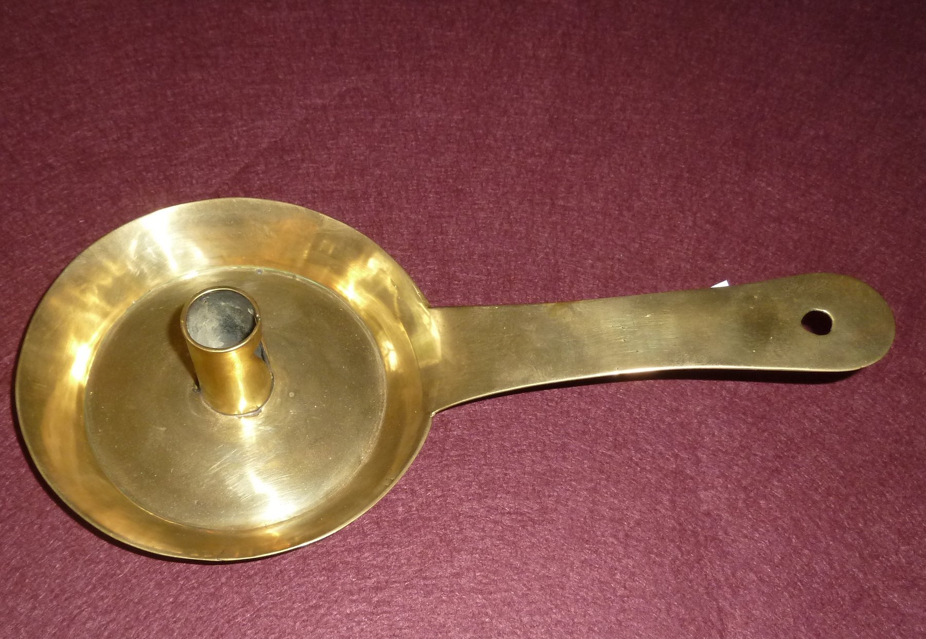 Appraisal: A brass chamber stick cm high Note the base and