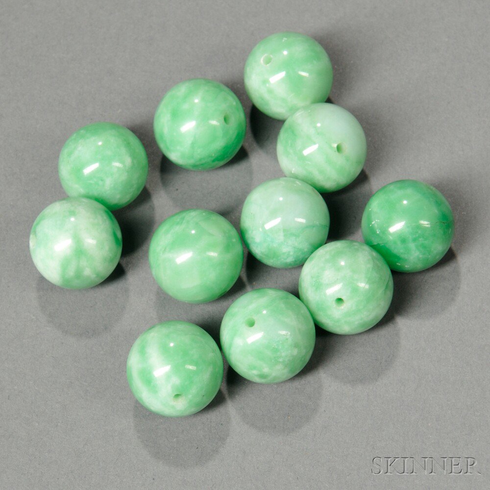 Appraisal: Jade Beads China eleven jadeite beads green stone with white