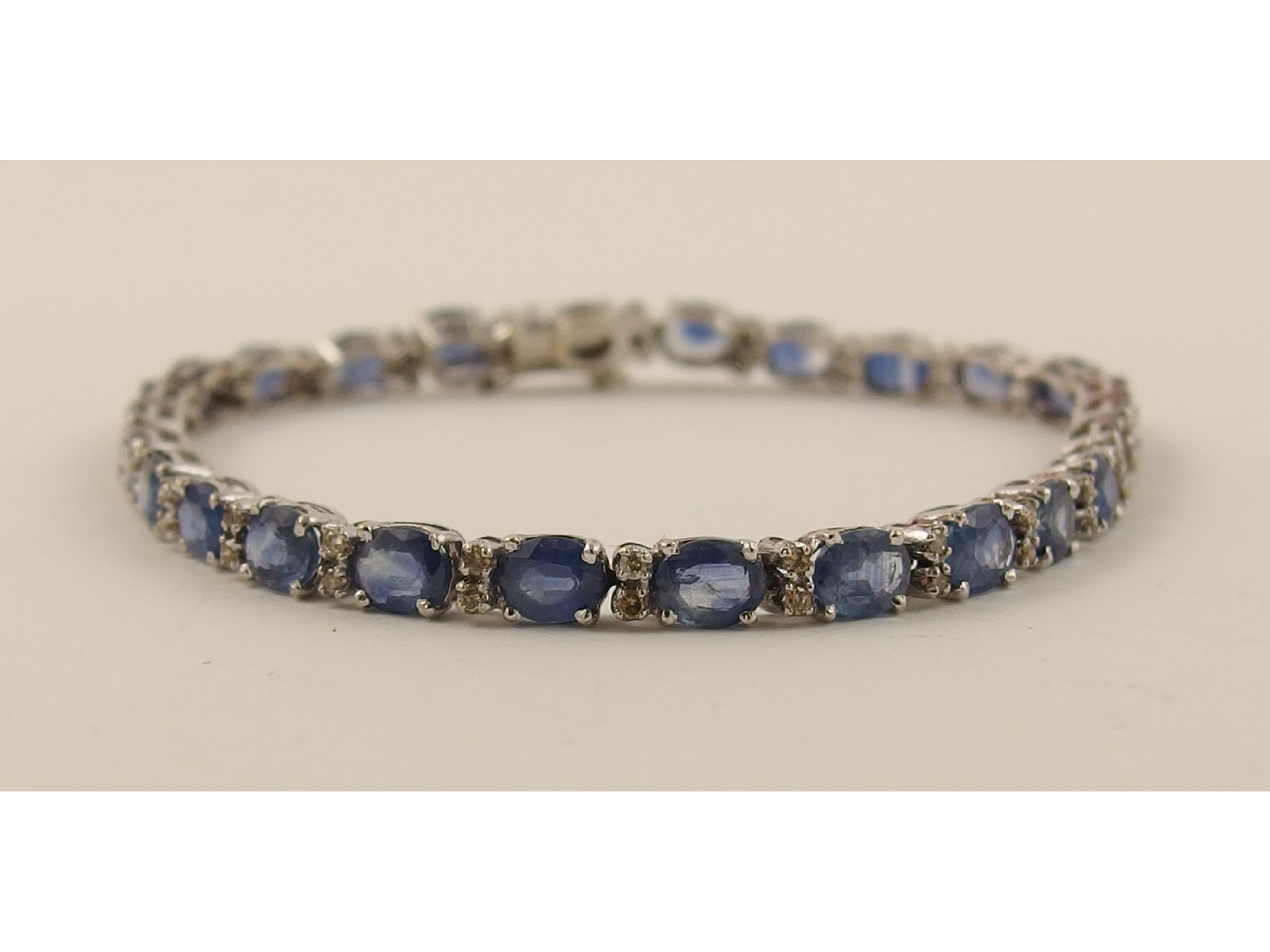 Appraisal: A sapphire and diamond braceletcomprising of twenty six Ceylon sapphires