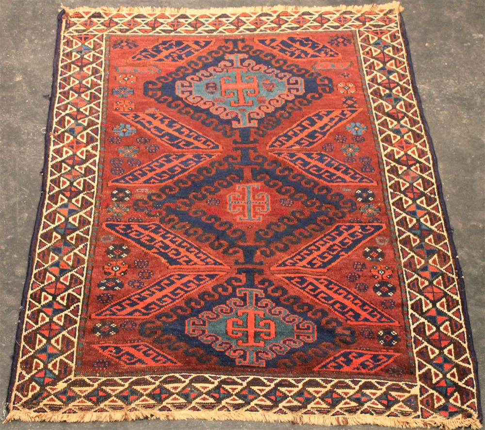 Appraisal: CAUCASIAN WOOL RUG having blues and reds with fringe approx