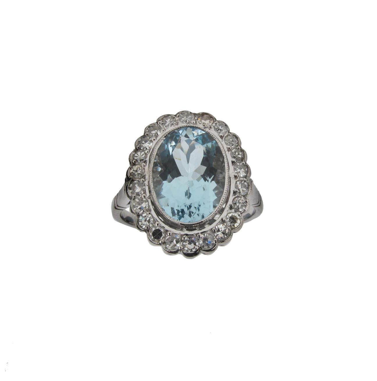 Appraisal: An aquamarine and diamond set cluster ring