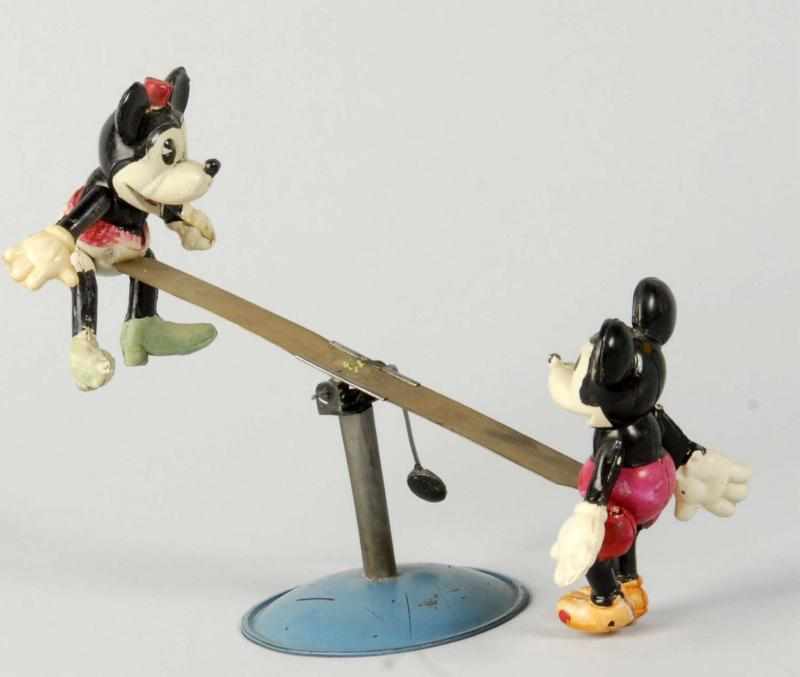 Appraisal: Celluloid Disney Mickey Minnie See-Saw Toy Description Japanese Circa s