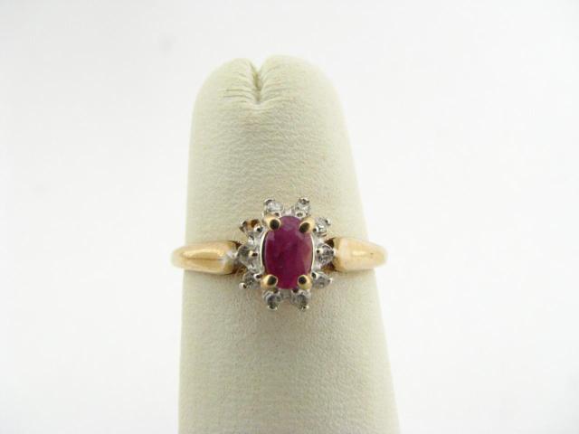 Appraisal: K yellow gold ring with small oval ruby center stone