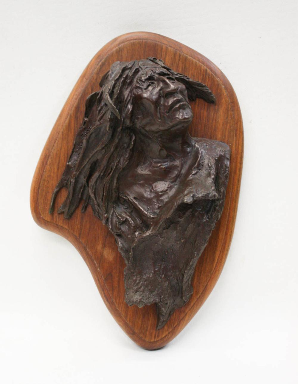 Appraisal: BUCK MCCLAIN American b bronze wall sculpture depicting a bust