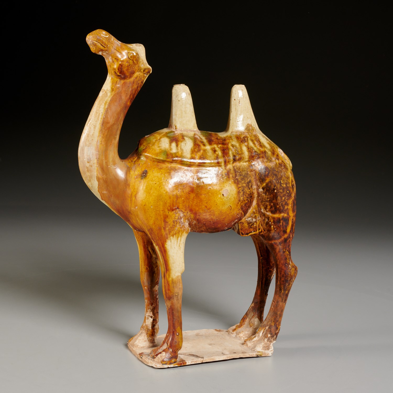 Appraisal: CHINESE BROWN GLAZED POTTERY BACTRIAN CAMEL Possibly Tang Dynasty th-