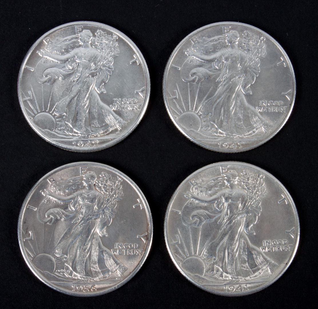 Appraisal: Four Walking Liberty type silver half dollars comprising two and