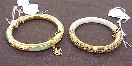 Appraisal: JEWELRY Two jade bracelets with brass findings on mutton fat