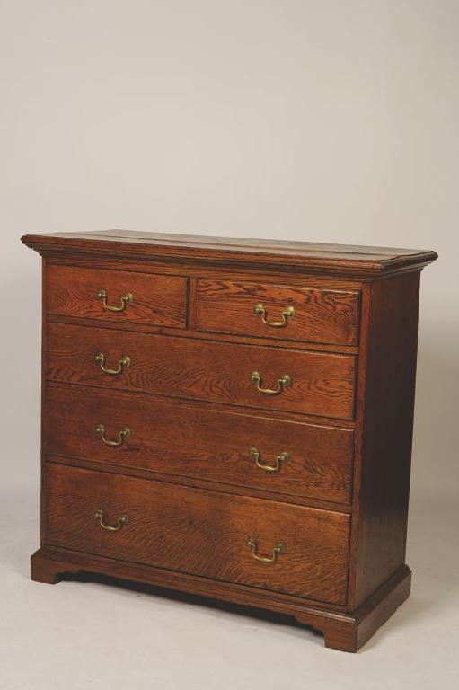 Appraisal: A GEORGE III OAK CHEST OF DRAWERS the rectangular top