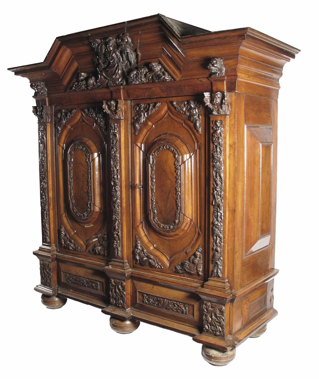 Appraisal: A south German walnut wardrobe with carved appliques